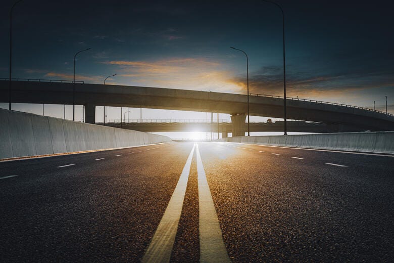 a road with a bridge over it