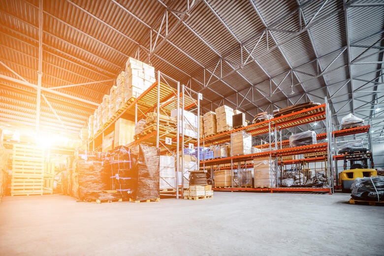 a warehouse with stacks of wood