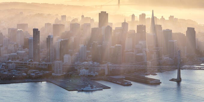 a city skyline with boats